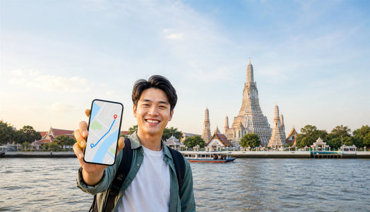 A traveler using a VOYA eSIM at Wat Arun in Bangkok, Thailand